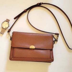 Coach brown leather hand bag.